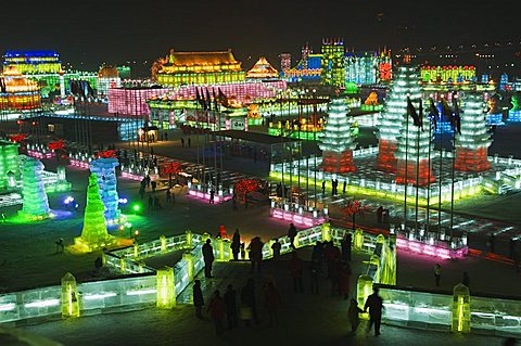 Snow and ice sculptures illuminated at night at the Ice Lantern Festival, Harbin, Heilongjiang Province, Northeast China, China, Asia